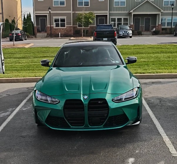 Green BMW M4 after an exterior detail